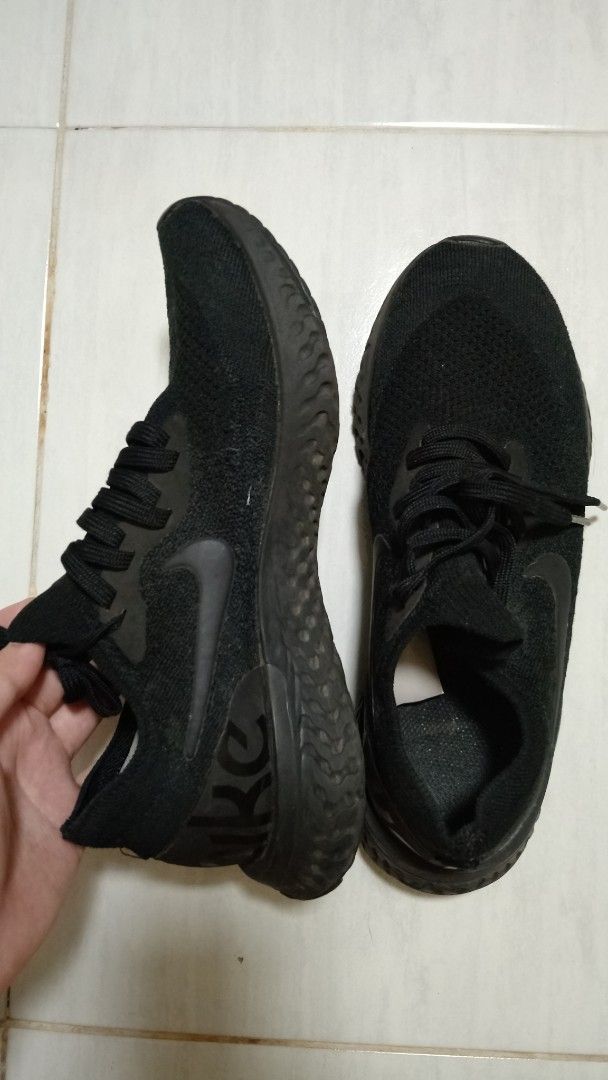 Nike Revolution 5 Black Running Shoes (Category: Sneakers) located in Makati City. Submitted by claire.1221 (Listing ID 1437234293, Image 1). Description: 📍Muntinlupa city or Makati city lalamove (same day deliver) or j&t (cheaper shipping fee, 3-4 days) -shouldered by buyer -no flaws -size 7.5 - Black Nike Revolution 5 - Black mesh upper - Black swoosh logo - Black soles with textured pattern - Size tag visible.
