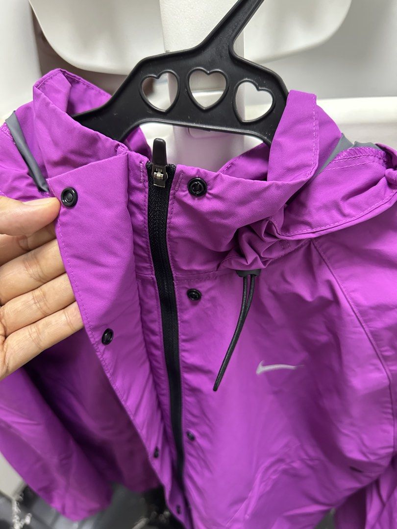 Nike Storm-FIT Jacket - Purple (Category: Coats, Jackets and Outerwear) located in Pasay City. Submitted by beyaaaa21 (Listing ID 1437330220, Image 2). Description: - Purple Nike Storm-FIT jacket - Size: L - Features a hood and zipper closure - Nike logo on the chest - Made in Vietnam.