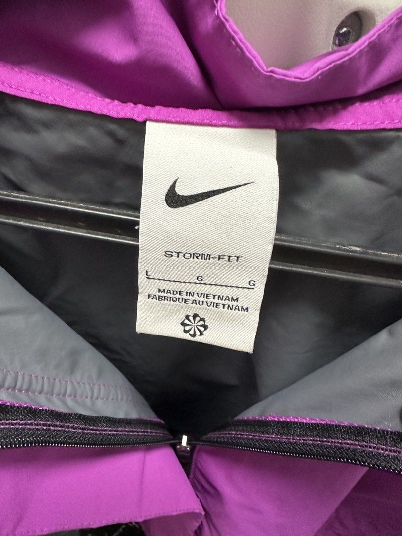 Nike Storm-FIT Jacket - Purple (Category: Coats, Jackets and Outerwear) located in Pasay City. Submitted by beyaaaa21 (Listing ID 1437330220, Image 3). Description: - Purple Nike Storm-FIT jacket - Size: L - Features a hood and zipper closure - Nike logo on the chest - Made in Vietnam.