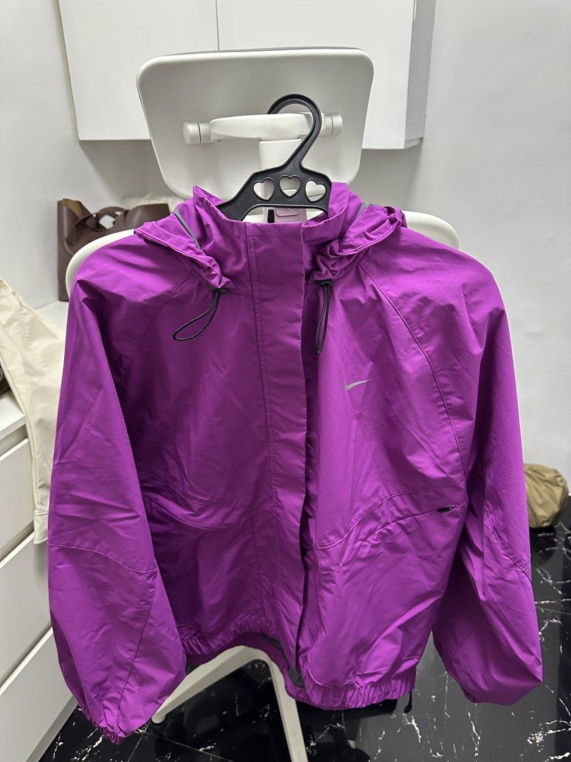 Nike Storm-FIT Jacket - Purple (Category: Coats, Jackets and Outerwear) located in Pasay City. Submitted by beyaaaa21 (Listing ID 1437330220, Image 1). Description: - Purple Nike Storm-FIT jacket - Size: L - Features a hood and zipper closure - Nike logo on the chest - Made in Vietnam.