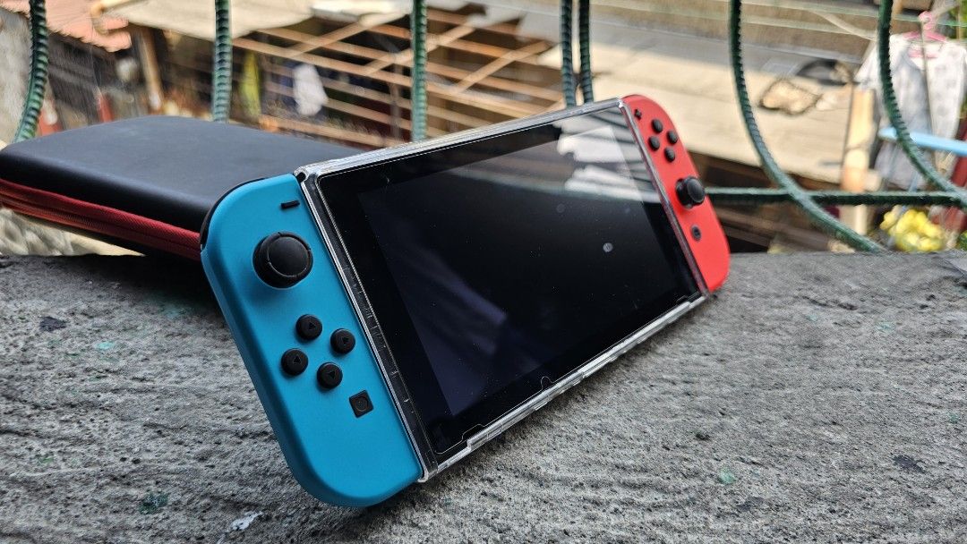 Nintendo Switch V2 (Category: Nintendo) located in Manila. Submitted by stephgrmnt (Listing ID 1437234820, Image 2). Description: Rarely used. Complete original accessories. Comes with Dobe hard cases (Holds complete set, and one that fits console and a few games) Tempered glass and protective shell installed since day 1 RFS: Hindi na nagagamit..