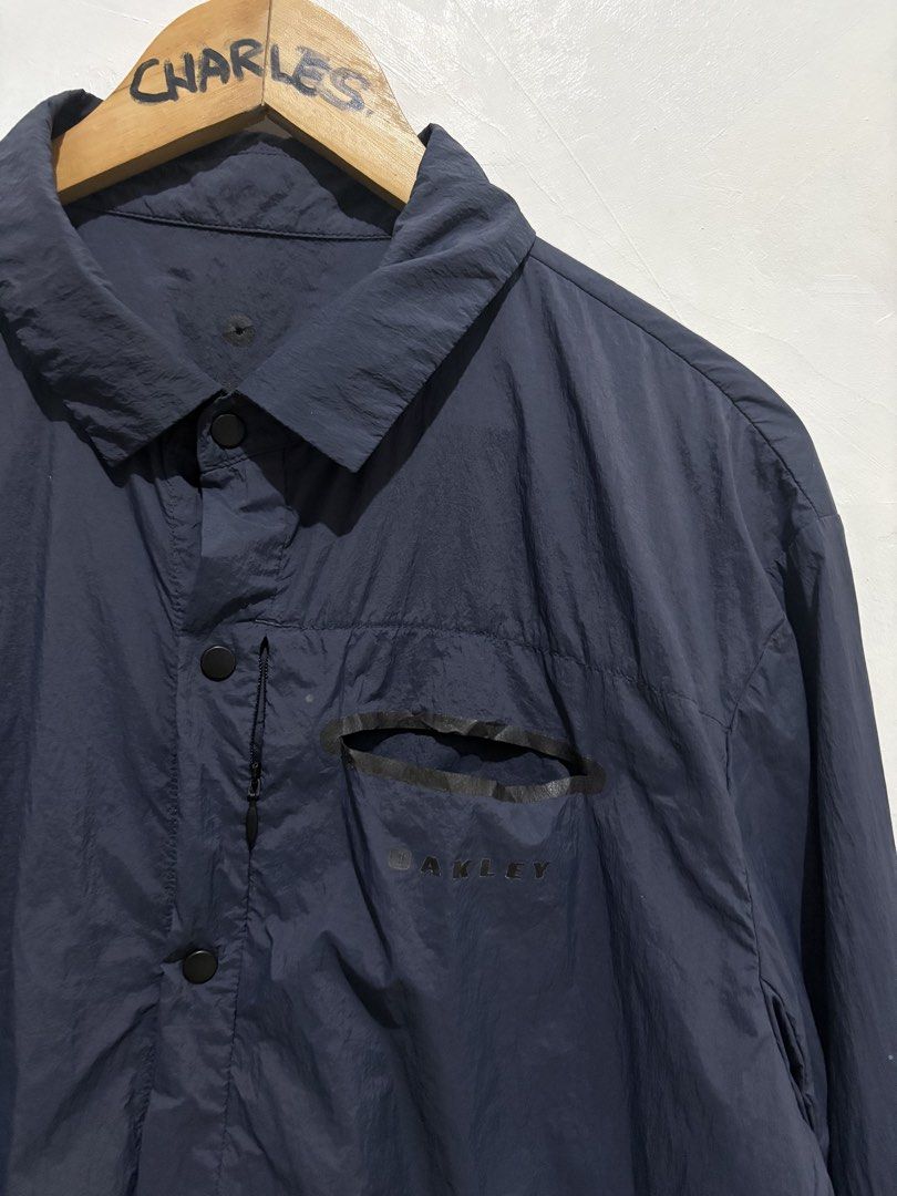 Oakley Utility Polyamide Nylon Custom Fit Shirt (Category: Tshirts & Polo Shirts ) located in Cabanatuan. Submitted by chingweyyy (Listing ID 1437221737, Image 2). Description: - Oakley custom fit shirt - Color: Navy blue - Design: Button-down, long-sleeved - Features: Chest pocket with zipper, Oakley logo - Size: XL (Japan), L (US/EU) - Made in Indonesia -23.5 Width 30 Length .