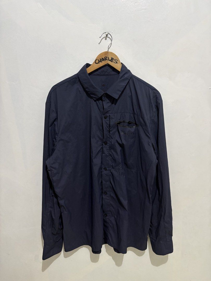 Oakley Utility Polyamide Nylon Custom Fit Shirt (Category: Tshirts & Polo Shirts ) located in Cabanatuan. Submitted by chingweyyy (Listing ID 1437221737, Image 3). Description: - Oakley custom fit shirt - Color: Navy blue - Design: Button-down, long-sleeved - Features: Chest pocket with zipper, Oakley logo - Size: XL (Japan), L (US/EU) - Made in Indonesia -23.5 Width 30 Length .