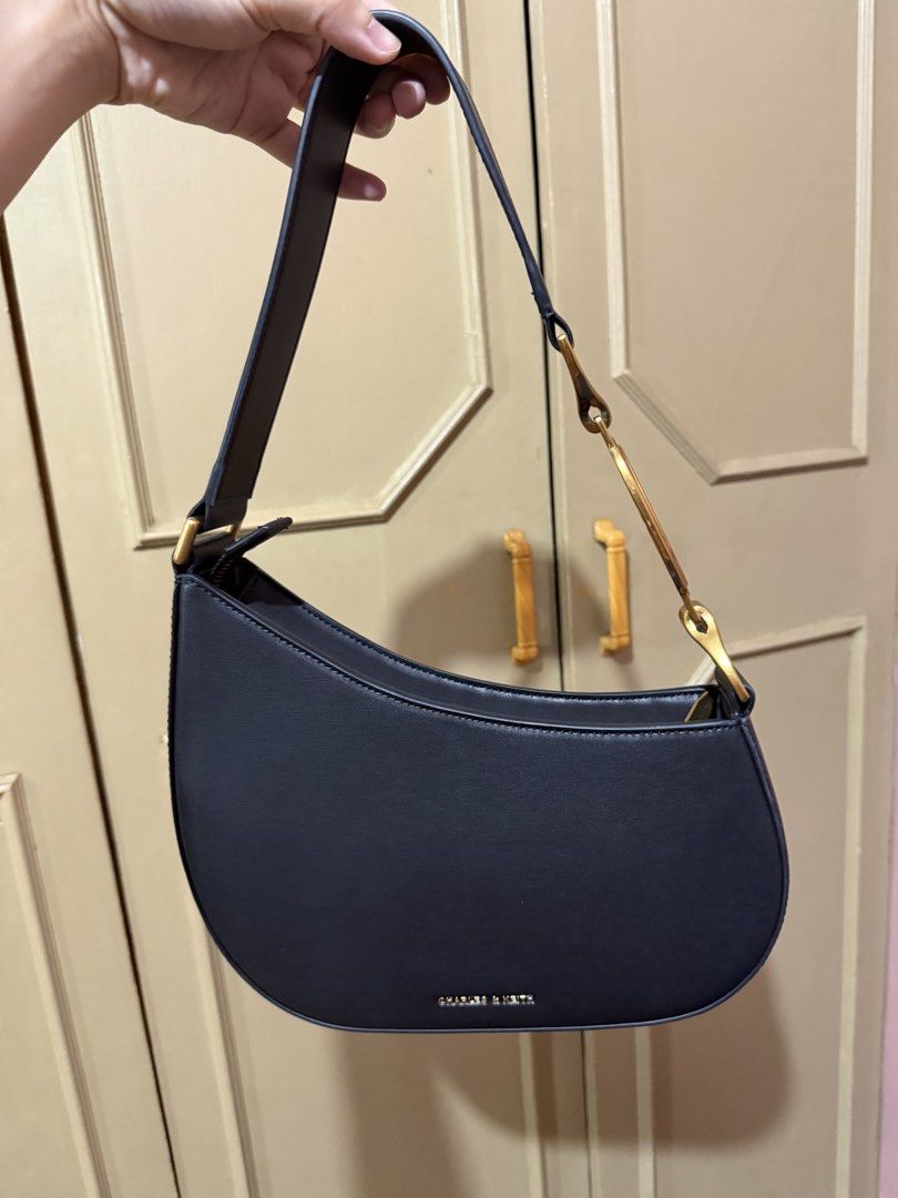 Original Charles & Keith black kilikili bag (Category: Luxury Bags & Wallets) located in Quezon City. Submitted by rjl.apparel (Listing ID 1437254921, Image 1). Description: -Used twice only. -Good as new -💯 original -bought in Singapore Charles & Keith store.