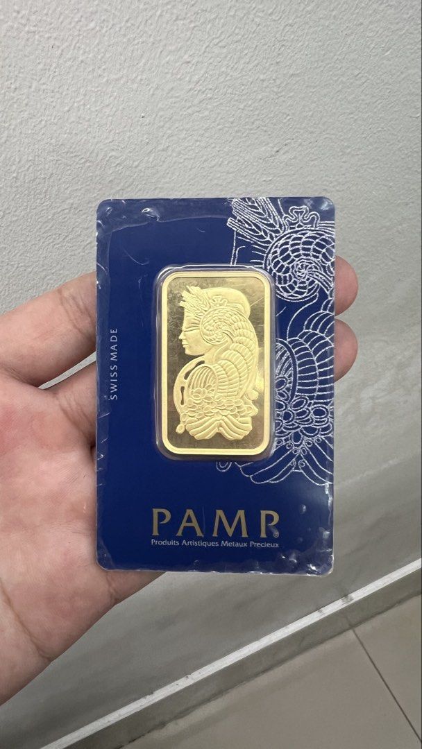 PAMP Suisse 1 Ounce Fine Gold Bar (Category: Currency) located in Quezon City. Submitted by goodstuffsssssph (Listing ID 1437247663, Image 1). Description: Genuine PAMP Suisse 1 ounce fine gold bar. Features a beautiful design and is made in Switzerland. The bar has a metal fineness of Au 999.9 and weighs 31.10g. Includes a certificate number C646956. The bar is sealed in its original packaging..