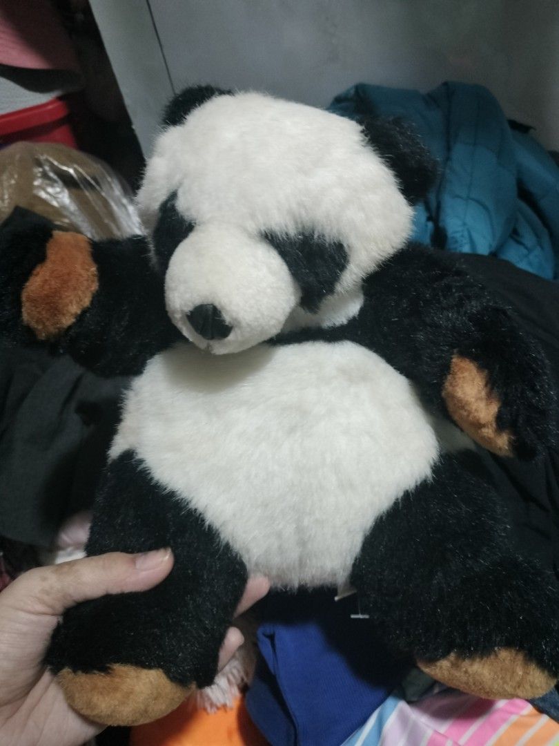 Panda Stuffed Toy (Category: Toys & Games) located in Pateros City. Submitted by GandakaHandpick2.0 (Listing ID 1437228047, Image 1). Description: - Adorable panda plush toy - Classic black and white design - Super soft and fluffy texture - Features a friendly expression - Black paws with brown accents - Great for snuggling - Ideal as a decorative piece need wash.