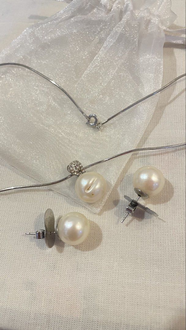 Pearl Necklace and Earrings Set (Category: Necklaces) located in Paranaque City. Submitted by mykillss (Listing ID 1437321817, Image 3). Description: - Pearl pendant necklace with delicate silver chain - Matching pearl stud earrings - Creamy white pearls - Pendant features small crystal accents - Earrings have butterfly backs.