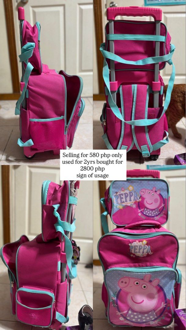 Peppa Pig Rolling School Bag USED (Category: Babies & Kids Fashion) located in Pasig City. Submitted by irishbellen (Listing ID 1437344325, Image 1). Description: - Pink Peppa Pig rolling school bag - Includes a lunch bag - Features a handle and wheels for easy transport with free lunch bag sign of usage RFS: Too small na for grade 2 - Used for 2 years - Selling for 580 php (originally 2800 php) open for lalamove self booking .