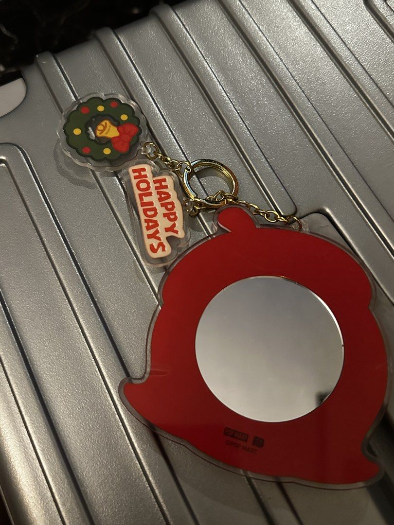 Popmart Molly Head Christmas Keychain (Category: Character Goods) located in Manila. Submitted by chasrz_ (Listing ID 1437275561, Image 2). Description: - Adorable keychain with a girl design. - Features a red beret and "Happy Holidays" tag. - Includes a small wreath charm. - Back of the keychain is a mirror. - Great accessory for keys or bags. - Adds a touch of holiday cheer..