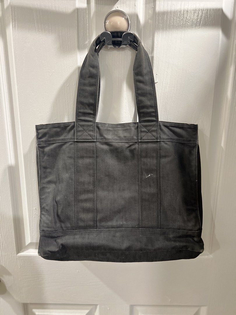 Porter Tokyo Grey Denim Tote Bag (Category: Tote Bags) located in Paranaque City. Submitted by btslite (Listing ID 1437382685, Image 3). Description: - Dimension (16x13 inches) - Made from durable, dark grey fabric - Features multiple interior pockets for organization - Sturdy handles for comfortable carrying - Rectangular shape ⚠️ Condition: Pre-loved / second-hand. Not brand new—may have minimal signs of use. 📍 Location: Parañaque City (near S