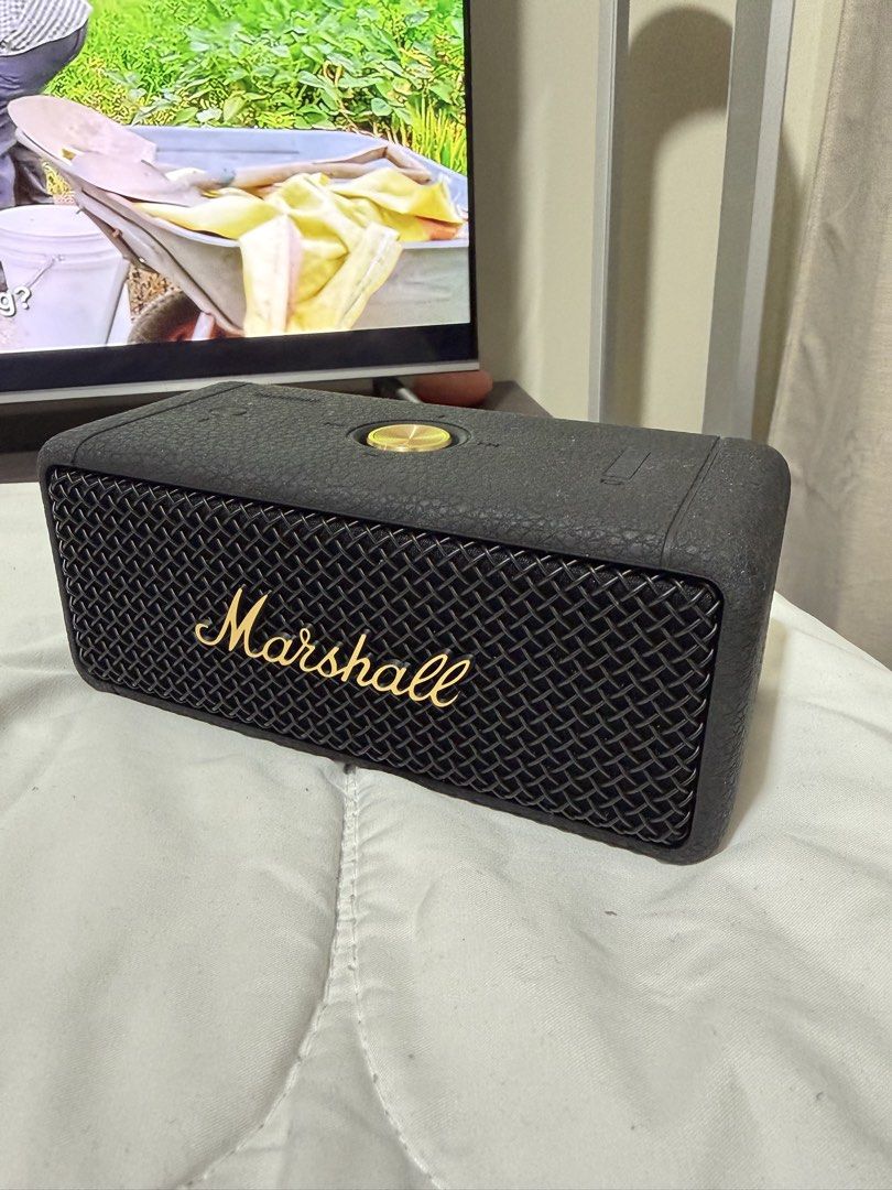 Pre-loved Authentic Marshall Emberton II Bluetooth Speaker (Category: Soundbars, Speakers & Amplifiers) located in Quezon City. Submitted by janabl (Listing ID 1437365992, Image 1). Description: Pre-loved Authentic Marshall Emberton II Bluetooth Speaker Original price P9,990. - Marshall Emberton II portable speaker - Stylish black and brass design - Over 30 hours of playtime - Dust and water-resistant - Features the iconic Marshall logo - Include