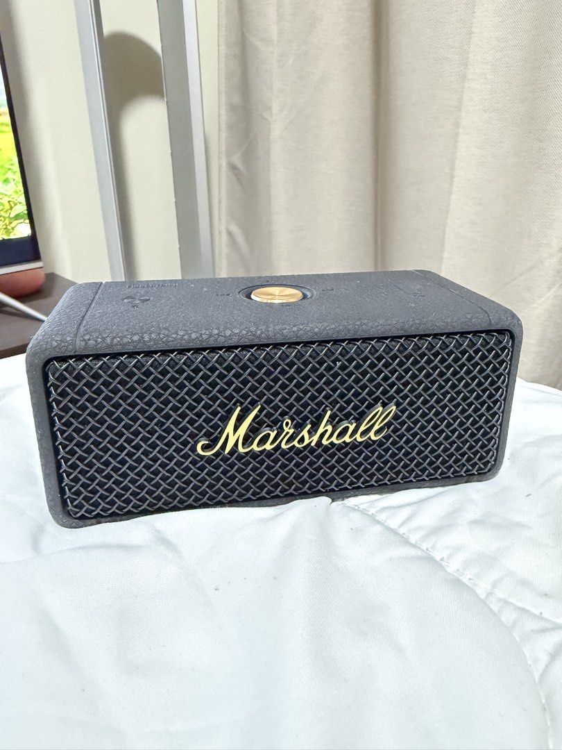 Pre-loved Authentic Marshall Emberton II Bluetooth Speaker (Category: Soundbars, Speakers & Amplifiers) located in Quezon City. Submitted by janabl (Listing ID 1437365992, Image 3). Description: Pre-loved Authentic Marshall Emberton II Bluetooth Speaker Original price P9,990. - Marshall Emberton II portable speaker - Stylish black and brass design - Over 30 hours of playtime - Dust and water-resistant - Features the iconic Marshall logo - Include