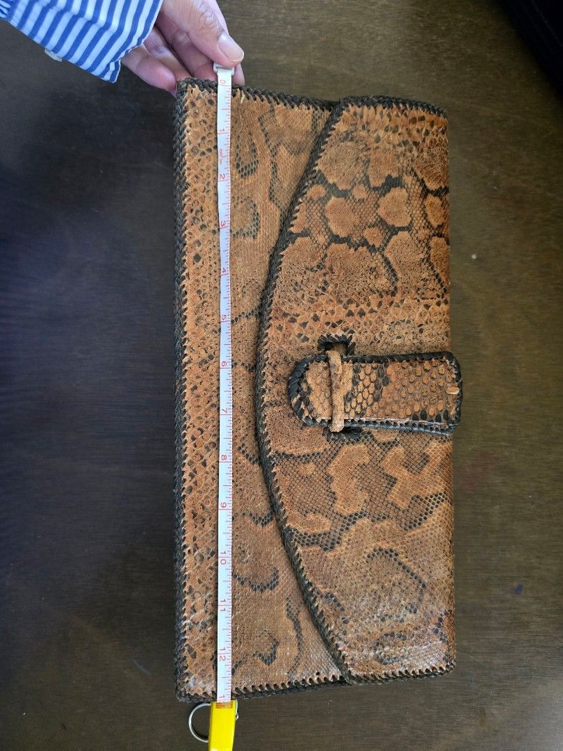 Python Skin Clutch bag (Category: Luxury Bags & Wallets) located in Davao. Submitted by moodsale (Listing ID 1424701795, Image 3). Description: Genuine snake skin phyton clutch bag. Inside of the bag is also leather.
