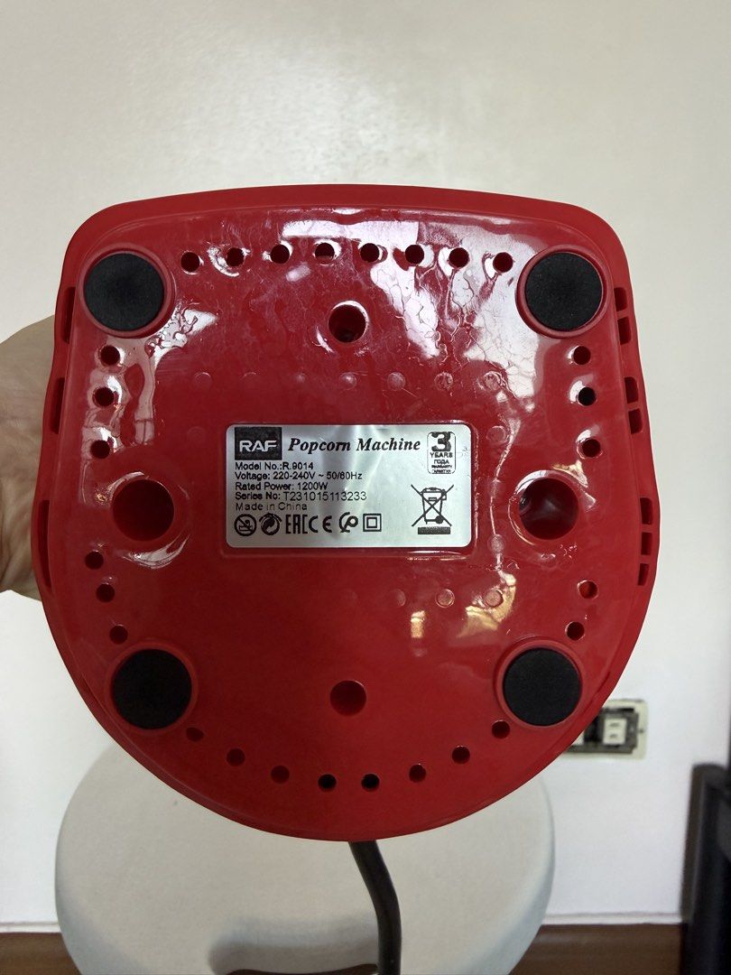 RAF Popcorn Machine R-9614 (Category: Fryers) located in Manila. Submitted by maag16 (Listing ID 1437220991, Image 3). Description: - RAF popcorn machine (Model R-9614) in red - Clear top and black power switch - Rubber feet on the base - Voltage: 220-240V, 50/60Hz - Philippine-style plug.