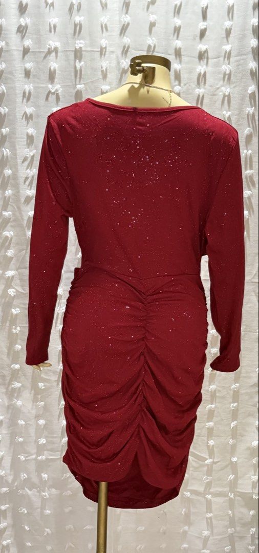 Red Glittery Long Sleeve Dress (Category: Dresses) located in Manila. Submitted by 2twentysix6 (Listing ID 1437347868, Image 3). Description: Elegant red dress with long sleeves and a flattering wrap-style top. Features a sparkly, glittery fabric that catches the light. The dress has a ruched detail at the back and a fitted skirt. Perfect for special occasions or a night out. The dress is designed to be form-fitting and stylish..