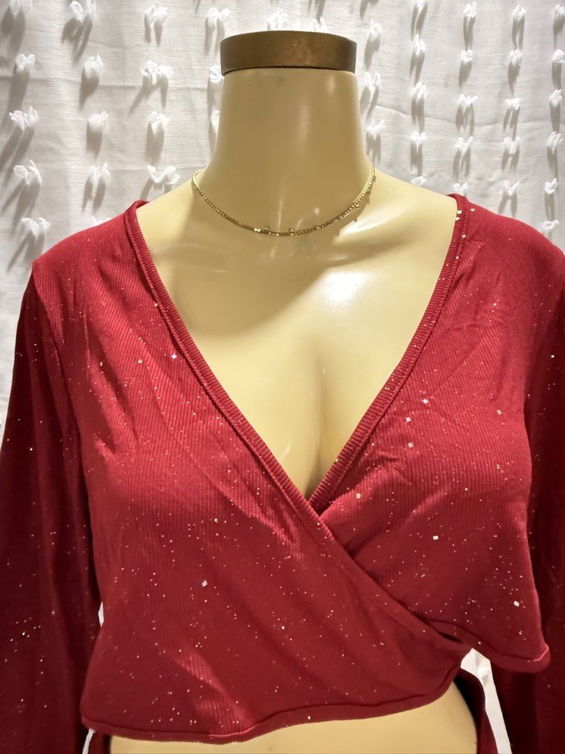 Red Glittery Long Sleeve Dress (Category: Dresses) located in Manila. Submitted by 2twentysix6 (Listing ID 1437347868, Image 2). Description: Elegant red dress with long sleeves and a flattering wrap-style top. Features a sparkly, glittery fabric that catches the light. The dress has a ruched detail at the back and a fitted skirt. Perfect for special occasions or a night out. The dress is designed to be form-fitting and stylish..