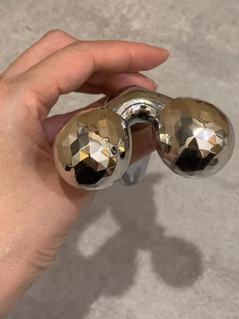 ReFa CARAT FACE Double Roller Facial Massager (Category: Face Care) located in Makati City. Submitted by swiftwind_fd3653 (Listing ID 1437284856, Image 3). Description: - Features two textured, faceted spheres. - Ergonomic, smooth handle. - Made of a shiny, metallic material. - Comes with a black velvet pouch for storage..