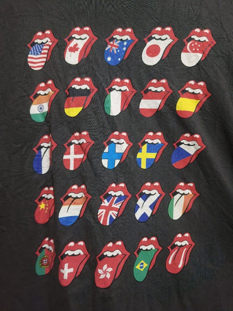Rolling Stones Tongue Flags Graphic Tee - Size L (Category: Tshirts & Polo Shirts ) located in Davao. Submitted by vndrgd (Listing ID 1437318141, Image 3). Description: Black Rolling Stones graphic tee features the iconic tongue logo with flags from various countries. It is a size L with a width of 21 inches and a length of 27.5 inches. The shirt has a crew neck and short sleeves. The graphic design is vibrant and well-preserved..