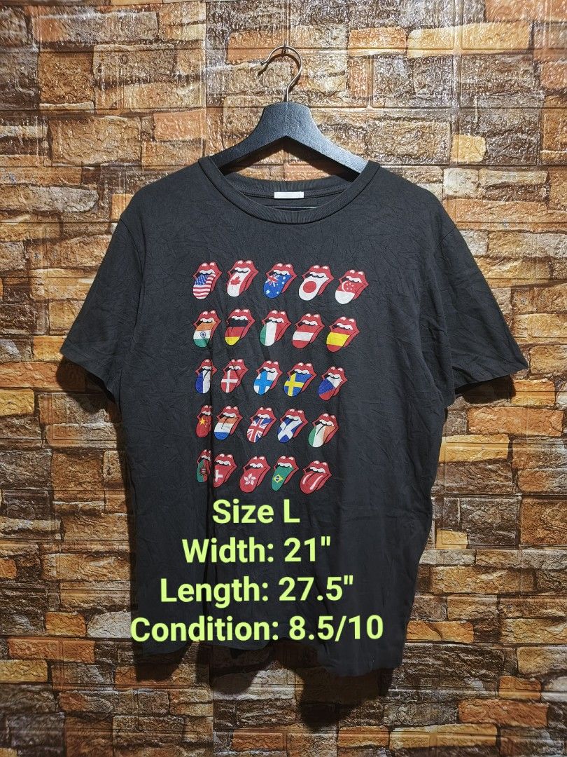 Rolling Stones Tongue Flags Graphic Tee - Size L (Category: Tshirts & Polo Shirts ) located in Davao. Submitted by vndrgd (Listing ID 1437318141, Image 1). Description: Black Rolling Stones graphic tee features the iconic tongue logo with flags from various countries. It is a size L with a width of 21 inches and a length of 27.5 inches. The shirt has a crew neck and short sleeves. The graphic design is vibrant and well-preserved..