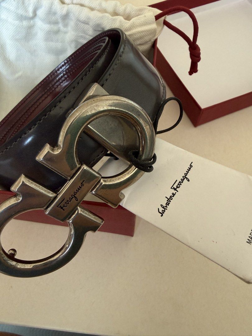 Salvatore Ferragamo Reversible Belt (Category: Belts) located in Cebu City. Submitted by frime (Listing ID 1437250398, Image 1). Description: Authentic Salvatore Ferragamo belt Reversible: Charcoal Grey and burgundy Includes original box and dust bag /tag Glossy leather finish Silver-tone Gancini buckle Size: 115 (measured actual around 48 inches end to end) .