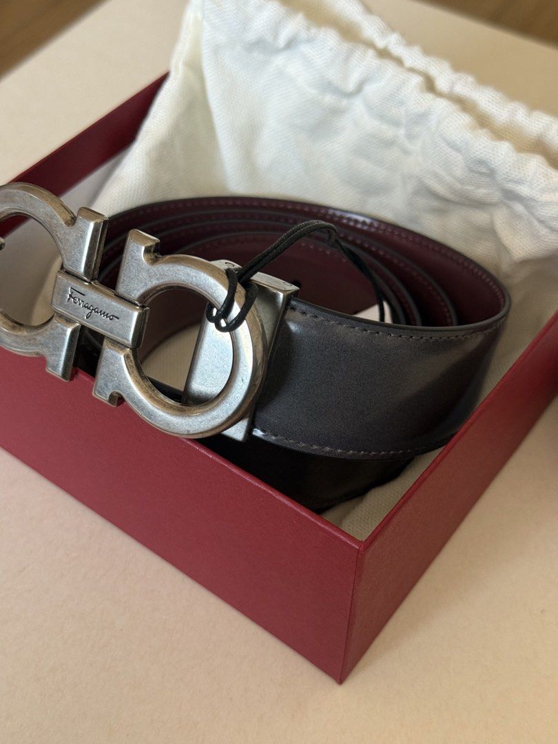 Salvatore Ferragamo Reversible Belt (Category: Belts) located in Cebu City. Submitted by frime (Listing ID 1437250398, Image 3). Description: Authentic Salvatore Ferragamo belt Reversible: Charcoal Grey and burgundy Includes original box and dust bag /tag Glossy leather finish Silver-tone Gancini buckle Size: 115 (measured actual around 48 inches end to end) .