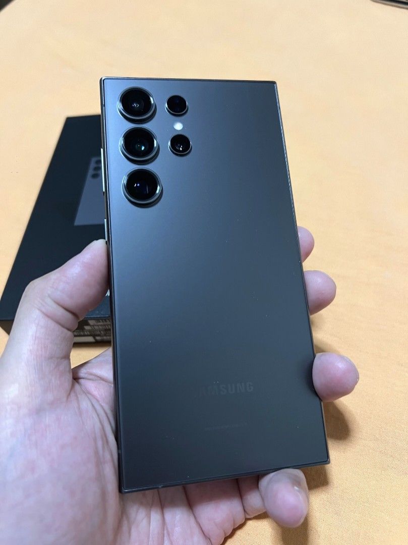 Samsung S24 Ultra 256 Gb (Category: Samsung) located in Quezon City. Submitted by daerek (Listing ID 1436541669, Image 2). Description: SAMSUNG S24 ULTRA AUTHENTIC TITANIUM BLACK COLOR 256 GB STORAGE SMART LOCKED 8 MONTHS OLD ACQUIRED SEPTEMBER 2025 NO ISSUES NO SCRATCHES NO DENTS NO REPAIRS. THIS PHONE IS VERY WELL TAKEN CARE OF. NO DROPS SINCE I OWNED IT. ITS JYST LIKE BUYING A BRAND NEW UNIT!!! INCLUSIONS & FREEBIES: 1. ORIGINAL BOX WITH ORIGI