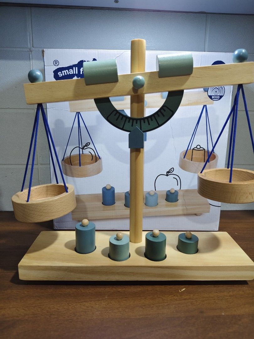 Small Foot Wooden Balance Scale (Category: Educational & Learning Toys) located in Las Pinas. Submitted by mommy_14 (Listing ID 1437325511, Image 2). Description: - Wooden balance scale by Small Foot. - Includes four weights and two balancing weights. - Designed for play and learning. - Introduces concepts of volume and density. - Approximate dimensions: 31 x 9 x 31 cm. - Suitable for ages 3+..