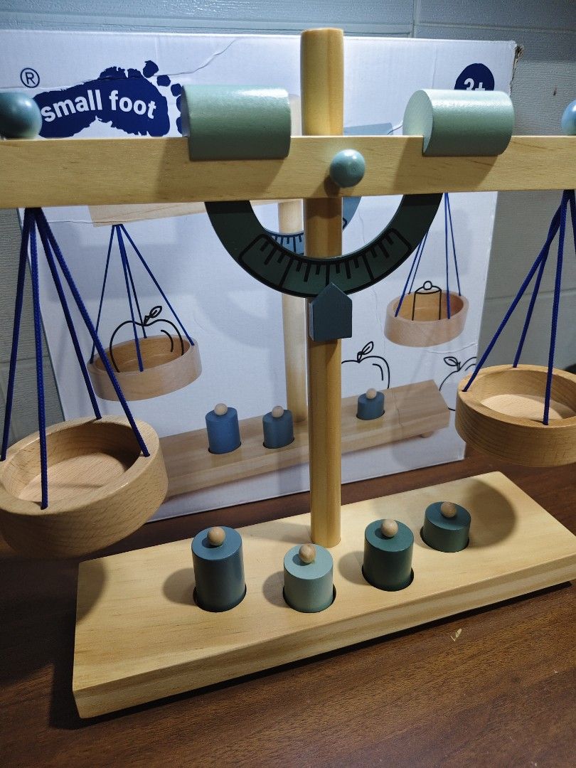 Small Foot Wooden Balance Scale (Category: Educational & Learning Toys) located in Las Pinas. Submitted by mommy_14 (Listing ID 1437325511, Image 3). Description: - Wooden balance scale by Small Foot. - Includes four weights and two balancing weights. - Designed for play and learning. - Introduces concepts of volume and density. - Approximate dimensions: 31 x 9 x 31 cm. - Suitable for ages 3+..