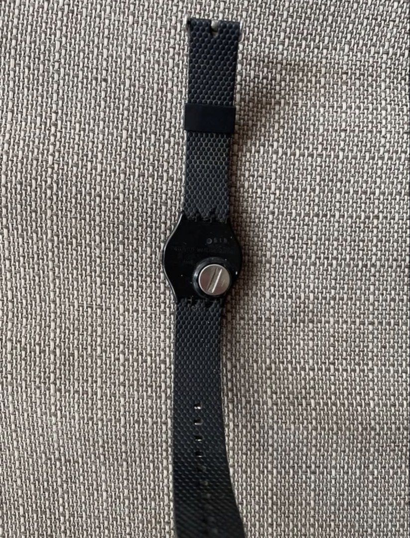 SWATCH Watch with Black Strap (Category: Women's Watches) located in Pasig City. Submitted by khaleisi (Listing ID 1437395064, Image 2). Description: - Swatch watch with a stylish black strap. - Eye-catching dial design with blue, white, and black elements. - Durable black case. - Secure silver buckle. - Textured strap material. - Authentic Swatch branding on the watch back. - Not original strap - With battery.