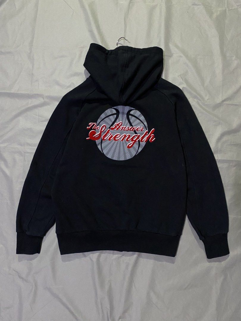 The Answer Strength Black Hoodie XL (Category: Hoodies) located in Manila. Submitted by _thriftanddrip (Listing ID 1437238414, Image 1). Description: Medium Like new ₱350 +sf Black hoodie with a full zip closure. Features a basketball graphic on the back with the words "The Answer Strength". The front has a small logo on the chest. The size tag indicates an XL size. The hoodie has a hood and long sleeves..