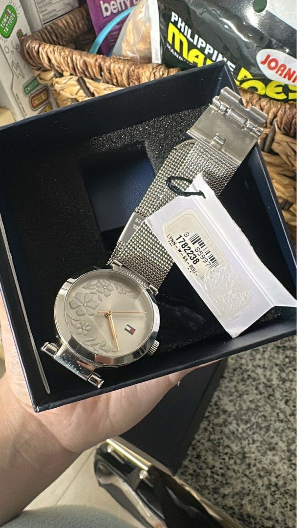 Tommy Hilfiger Lynn Watch (Category: Women's Watches) located in Manila. Submitted by pure.brown.sugar (Listing ID 1437303892, Image 1). Description: - Tommy Hilfiger watch - Silver mesh strap - Floral design watch face - Silver case - Gold-tone hands - Model: 1782238 - Includes original box and tag.