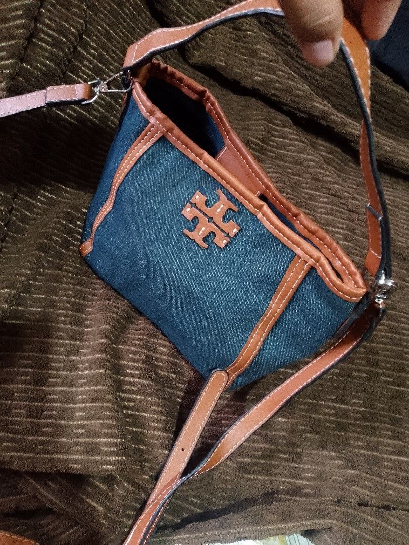 Tory Burch, MCGRAW Denim (Category: Luxury Bags & Wallets) located in Lugait. Submitted by celestemen26716 (Listing ID 1437311166, Image 1). Description: tory Burch 2 way mini bucket bag denim cloth type outer naka suede ang tela sa inner ng bag with etikita, sign of used snap lock all hardware materials is in good condition. price negotiable Free shipping.