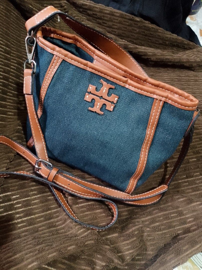 Tory Burch, MCGRAW Denim (Category: Luxury Bags & Wallets) located in Lugait. Submitted by celestemen26716 (Listing ID 1437311166, Image 3). Description: tory Burch 2 way mini bucket bag denim cloth type outer naka suede ang tela sa inner ng bag with etikita, sign of used snap lock all hardware materials is in good condition. price negotiable Free shipping.