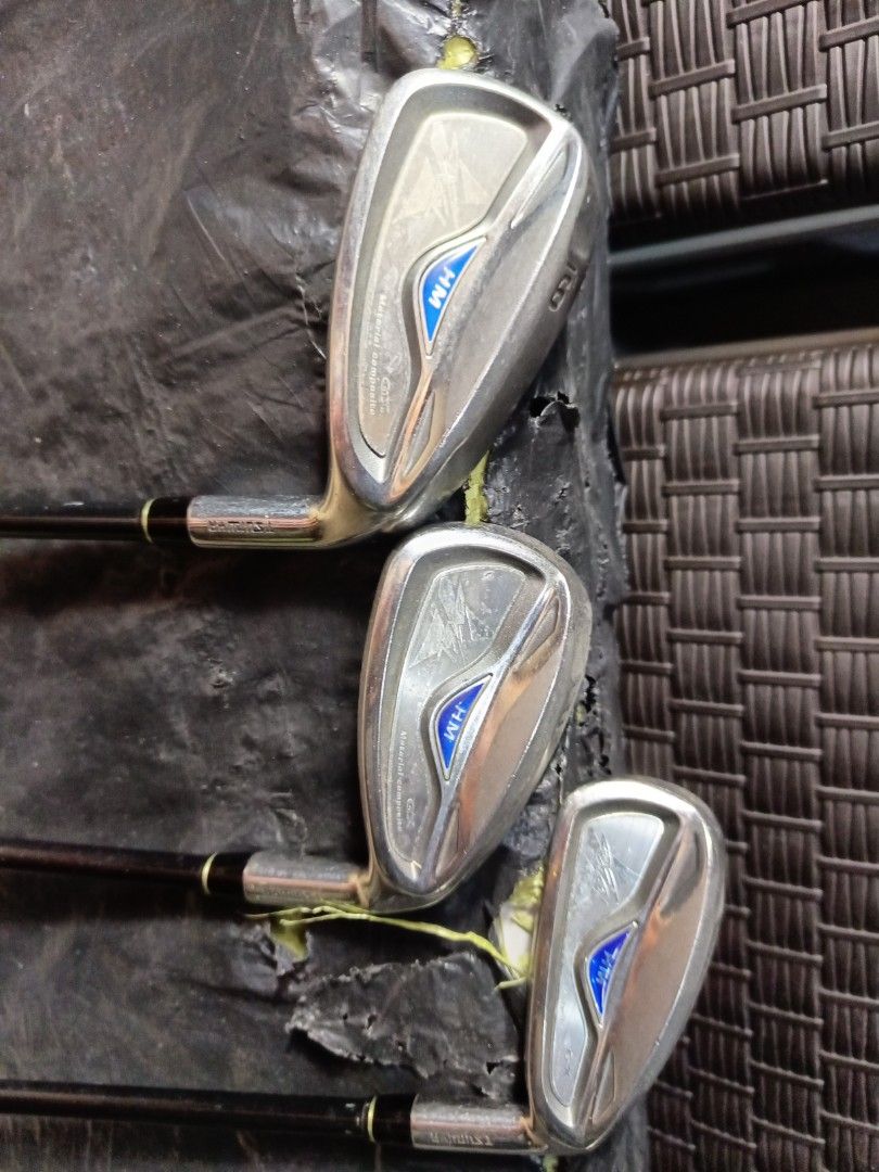Tsuruya axel hm iron for practice (Category: Golf) located in Manila. Submitted by yeonmei5614747 (Listing ID 1437218454, Image 1). Description: - Golf club set includes6 & 9 iron and pitching wedge. - Features black shafts with silver and blue accents. - Club heads are silver with a blue and white design. - Grips are black and textured..