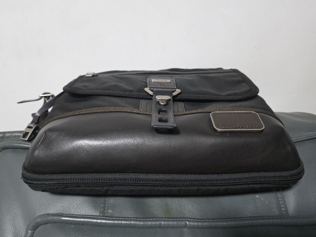Tumi Shoulder Bag (Category: Luxury Bags & Wallets) located in Cabuyao City. Submitted by swiftdeer.ed9787 (Listing ID 1437319989, Image 3). Description: For sale price: 7k Location: Cabuyao Laguna This is Authentic 100% slightly used no issue - Black Tumi shoulder bag - Front flap with buckle closure - Zippered compartment - Leather tag with Tumi logo - Adjustable shoulder strap - Back pocket - Interior tag with Tumi logo and serial number.