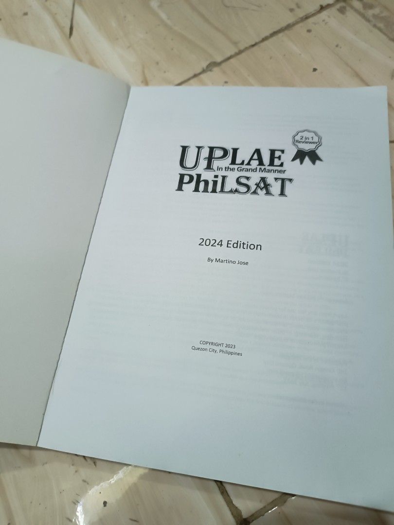 UPLAE PhilSAT Reviewer 2024 Edition (Category: Textbooks) located in Manila. Submitted by patriciahannigan (Listing ID 1437294919, Image 2). Description: - UPLAE PhilSAT Review Book (2024 Edition) - Designed for PhilSAT exam preparation - Published by Graphic City, Philippines - 2-in-1 review book - Features a cover with a silhouette and "UPLAE in the Grand Manner PhilSAT" text - Location: Cavite.