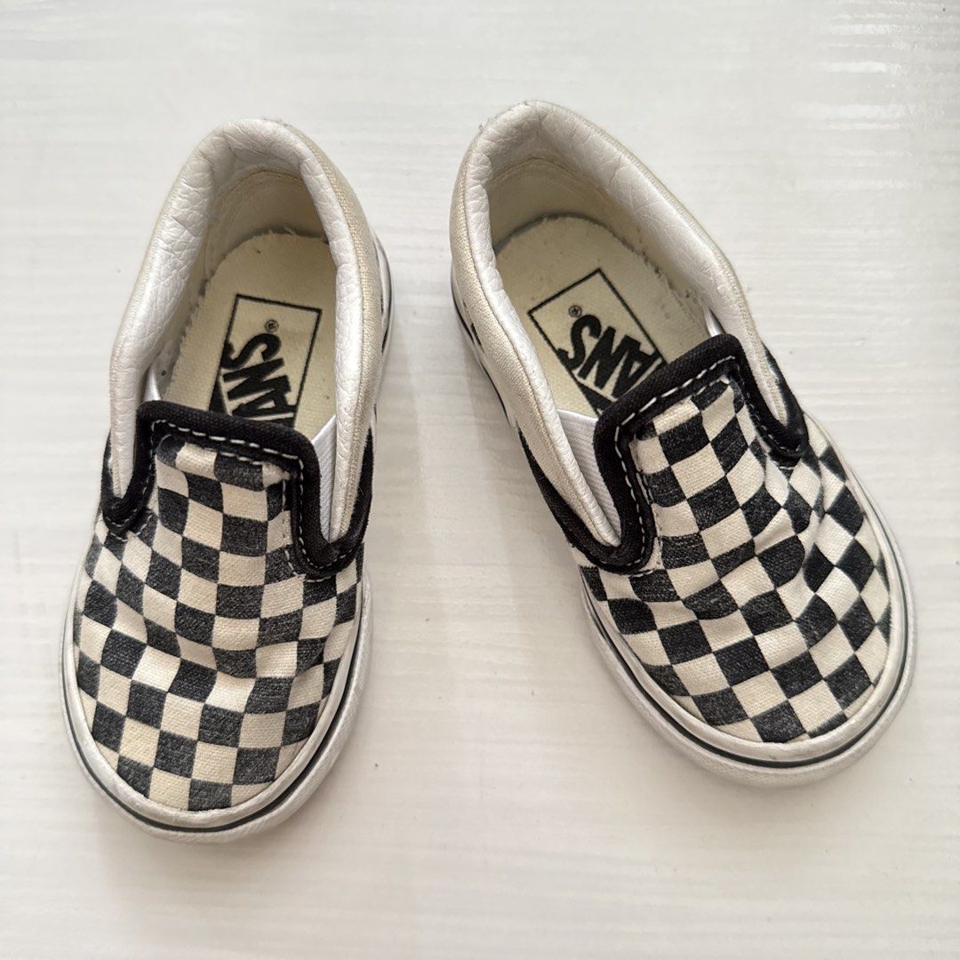 Vans Checkerboard Slip-On Shoes (Category: Babies & Kids Fashion) located in Cavite. Submitted by gccwardrobe (Listing ID 1437277503, Image 1). Description: - Vans Kids Slip-On Shoes - Classic Checkerboard Pattern - Black and White Colorway - White Sole - Size: 11.5 CM - Features Vans logo - Designed for Kids.