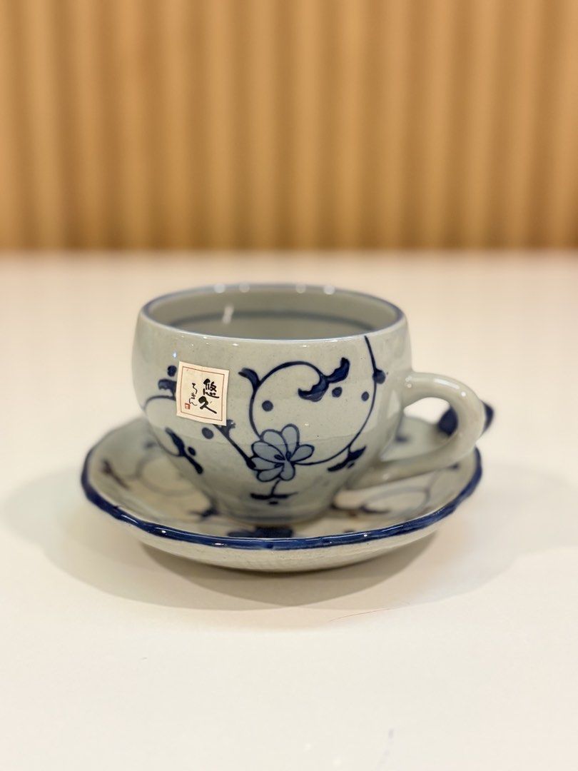 Vintage Ceramic Teacup and Saucer Set (Category: Coffee & Tea Tableware) located in Bayambang. Submitted by kristagraces77 (Listing ID 1437243419, Image 2). Description: - Ceramic teacup and saucer set - Light gray base - Intricate blue floral and vine patterns - Rounded teacup with handle - Matching saucer design - Includes decorative knob - Ideal for tea or coffee.