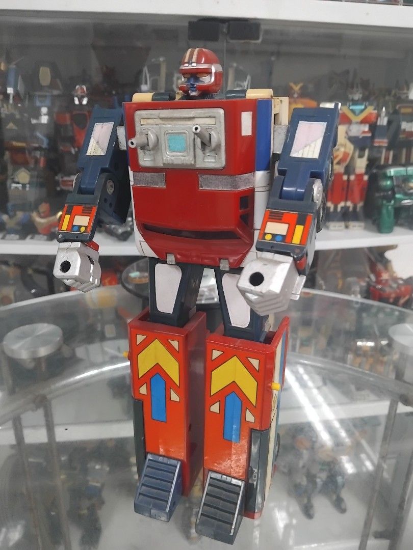 Vintage Land Galaxy Robo (Category: Kids Toys) located in San Fernando. Submitted by imlikeabird (Listing ID 1437331660, Image 1). Description: - Vintage robot toy - Transforms into a truck - Red, blue, and white colors - Articulated arms and legs.