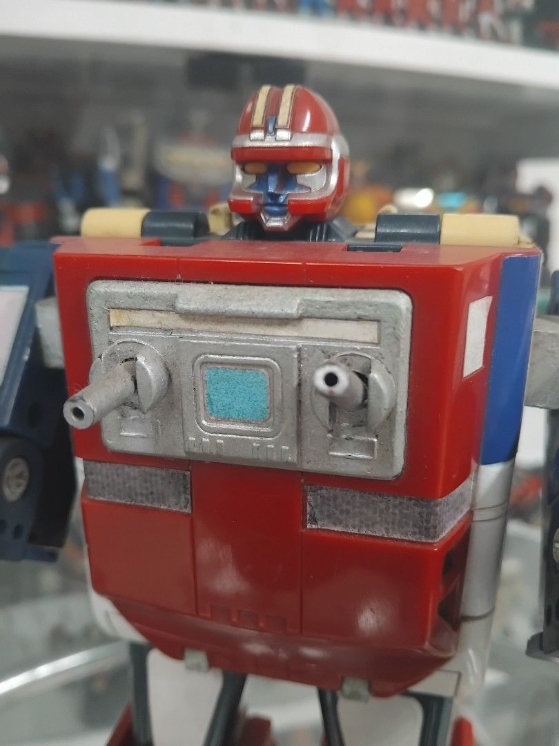 Vintage Land Galaxy Robo (Category: Kids Toys) located in San Fernando. Submitted by imlikeabird (Listing ID 1437331660, Image 2). Description: - Vintage robot toy - Transforms into a truck - Red, blue, and white colors - Articulated arms and legs.