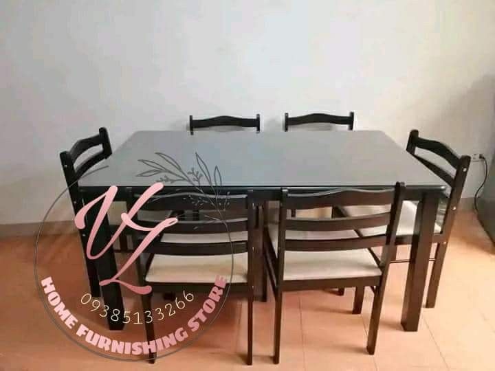 Wooden Dining Table Set with 6 Chairs (Category: Tables & Sets) located in Manila. Submitted by lykcacamacho07 (Listing ID 1437287545, Image 1). Description: - Wooden dining set - Rectangular table - Six matching chairs - Cushioned seats for comfort - Dark finish - Perfect for dining and entertaining.