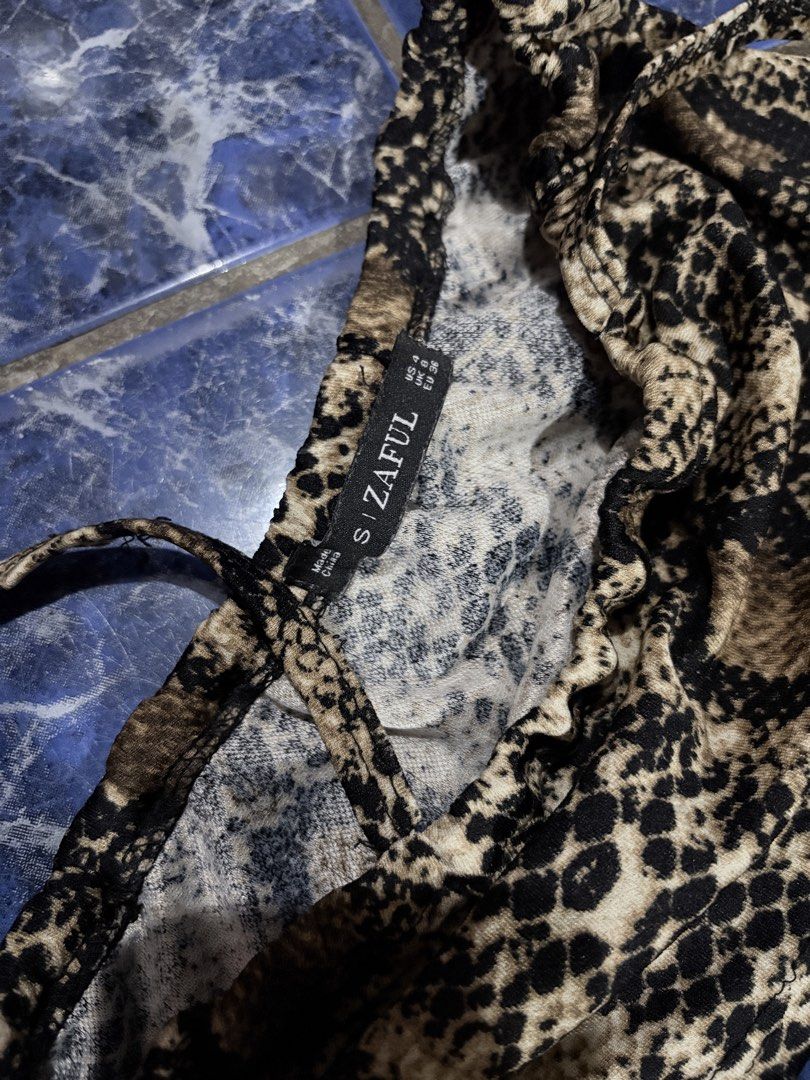Xara Snake Print Tube Top (Category: Sleeveless) located in Manila. Submitted by ccarchives (Listing ID 1437241310, Image 2). Description: small on tag but fits better on xs! xxs-small.