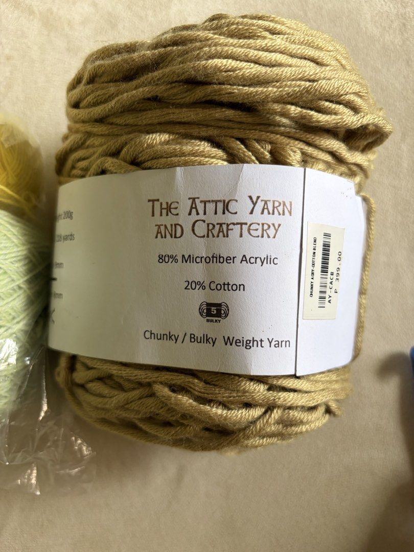 Yarn and Crochet Hook Set (Category: Craft Supplies & Tools) located in Binan City. Submitted by ukaynikukay (Listing ID 1437241720, Image 2). Description: Yarn set for crochet Includes: - Red, yellow, and green yarn skeins - Large chunky yarn skein from The Attic Yarn and Crafty - Crochet hooks: - 10.0mm blue hook - 9.00 mm purple hook Perfect for your next crochet project!.