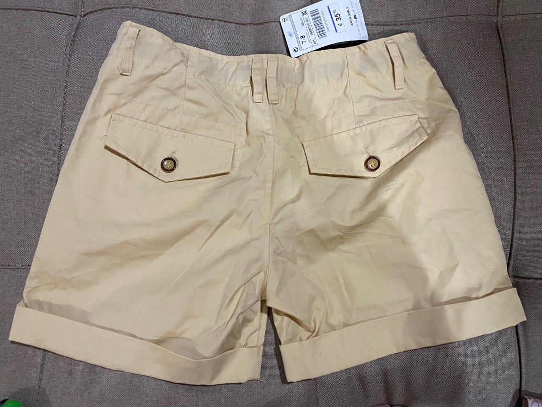 Zara Girls Shorts Size 7-8 (Category: Babies & Kids Fashion) located in Manila. Submitted by stockroompreloved (Listing ID 1437350721, Image 3). Description: - Zara girls' shorts - Size: 7-8 years (128cm) - Color: Light tan - Features: Floral lining, two buttoned back pockets - Condition: New with tags.