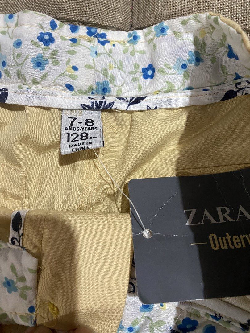 Zara Girls Shorts Size 7-8 (Category: Babies & Kids Fashion) located in Manila. Submitted by stockroompreloved (Listing ID 1437350721, Image 2). Description: - Zara girls' shorts - Size: 7-8 years (128cm) - Color: Light tan - Features: Floral lining, two buttoned back pockets - Condition: New with tags.