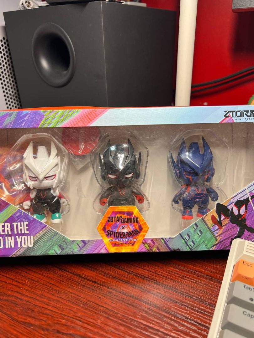 Zotac Gaming x Spider-Man: Across the Spider-Verse Mini Figures Set Collection (Category: Toys & Games) located in Baguio. Submitted by ditoyzb08176 (Listing ID 1437345182, Image 3). Description: - Zotac Gaming Spider-Man Figurine Set - Includes three different Spider-Man designs - Features the Zotac Gaming logo and "Power the Hero in You" on the box - Figurines are in original packaging -RARE Gaming FIG Location: BAguio City Shipping: J&T/FLASH/
