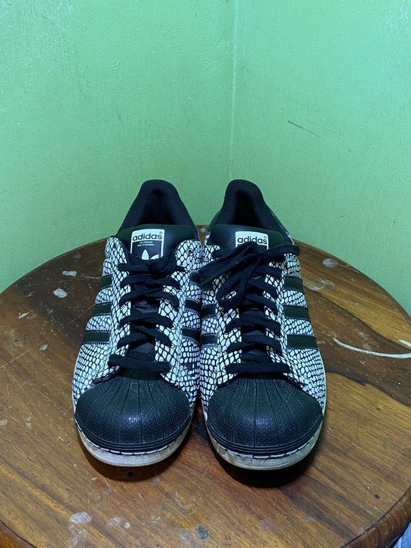 Adidas Superstar Snake Print Sneakers (Category: Sneakers) located in Bayombong. Submitted by calthrift.us (Listing ID 1437515379, Image 2). Description: - Adidas Superstar sneakers - Unique snake print design - Classic three stripes and shell toe - Size: US 10, UK 9.5, EUR 44 - Made in Indonesia - Signs of wear on soles and uppers -AMTF.