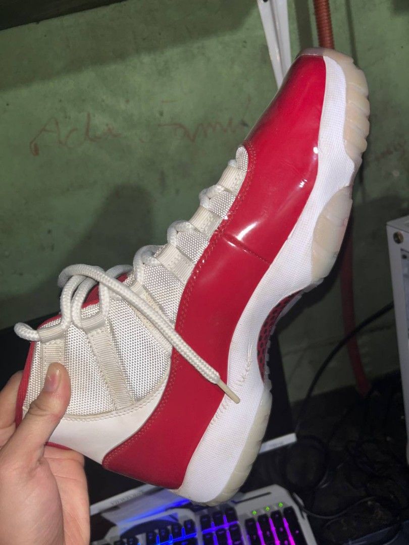 Air Jordan 11 Retro Cherry (Category: Sneakers) located in Manila. Submitted by stylish_thrift (Listing ID 1437494197, Image 3). Description: - Air Jordan 11 Retro 'Cherry' - Red patent leather upper - White mesh and accents - White laces - Translucent outsole - Jumpman logo visible - Yellowish Color - 4 Times used - 16,000 ORIG Price - Buy in shoe game manila - With box but sira konti sa katagalan - Negotiable - Can do meetupo or video call to c