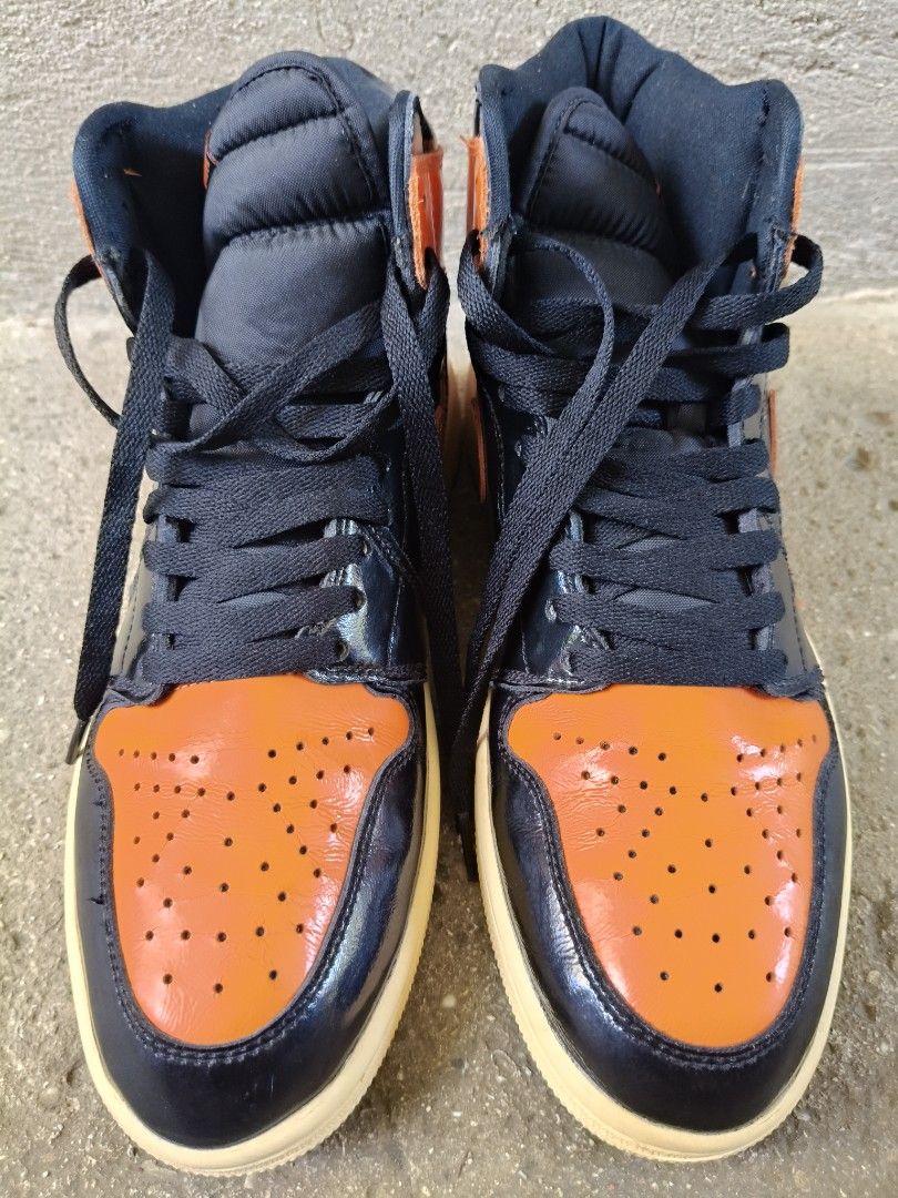 Air Jordan 1 High OG Shattered Backboard (Category: Sneakers) located in Tagbilaran City. Submitted by johnmcee (Listing ID 1437425457, Image 3). Description: Air Jordan 1 High OG Shattered Backboard sneakers. US10, Eu44, 28cm. With some signs of usage. - Black and orange colorway - Iconic Nike swoosh - High-top design with padded collar - Classic lace-up closure - Cream-colored outsole - Air Jordan wings logo on the ankle Shipping fee 100 .