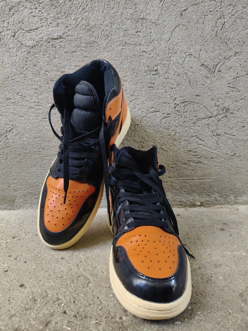 Air Jordan 1 High OG Shattered Backboard (Category: Sneakers) located in Tagbilaran City. Submitted by johnmcee (Listing ID 1437425457, Image 2). Description: Air Jordan 1 High OG Shattered Backboard sneakers. US10, Eu44, 28cm. With some signs of usage. - Black and orange colorway - Iconic Nike swoosh - High-top design with padded collar - Classic lace-up closure - Cream-colored outsole - Air Jordan wings logo on the ankle Shipping fee 100 .